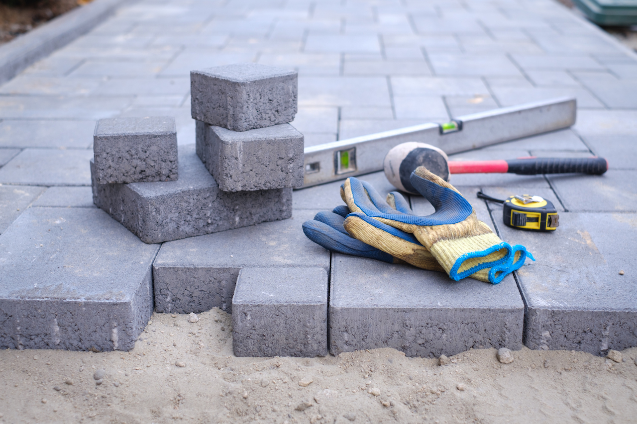 paving stones setup with tools for hardscaping